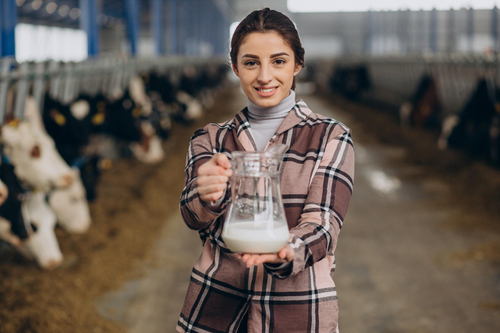 Dairy business - Women standing with milk jar